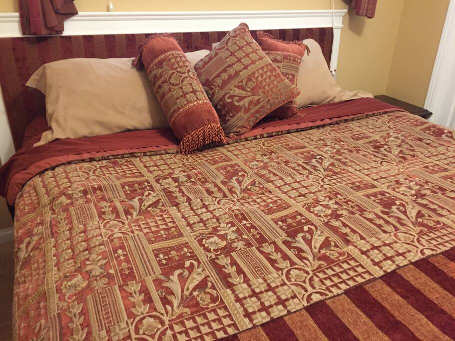 Rustic Themed room with King Sized Bed, work desk, and lots of light