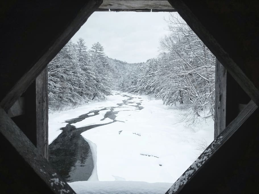 A view on the covered bridge on our road.
