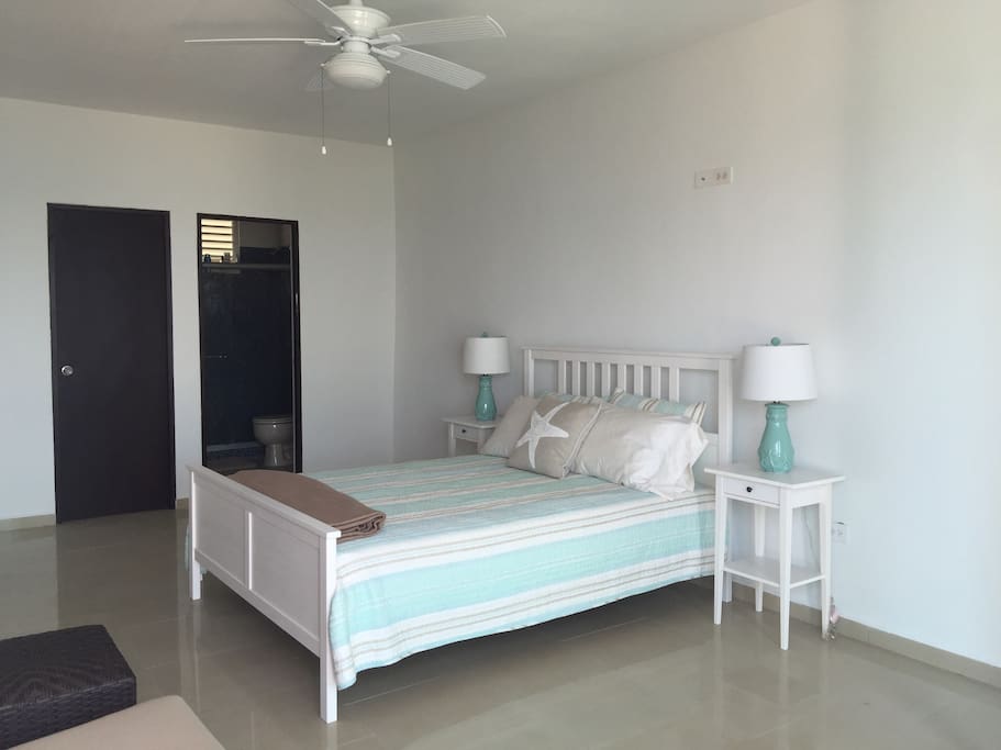 The second floor has the master bedroom w a queen size bed w. bath, a terrace with half bathroom.