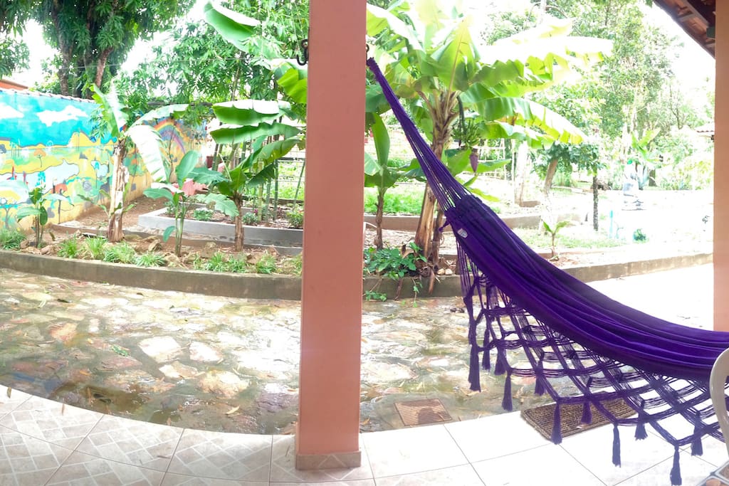 The veranda with hammocks to relax and enjoy the view on the garden