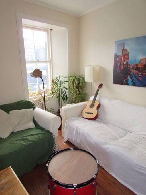 Bright and spacious living room overlooking the Royal Mile.