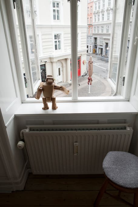 View of the street from the bedroom. This guy will keep you company. He's quiet and well grounded. Oh, that's a great café in the background by the way.