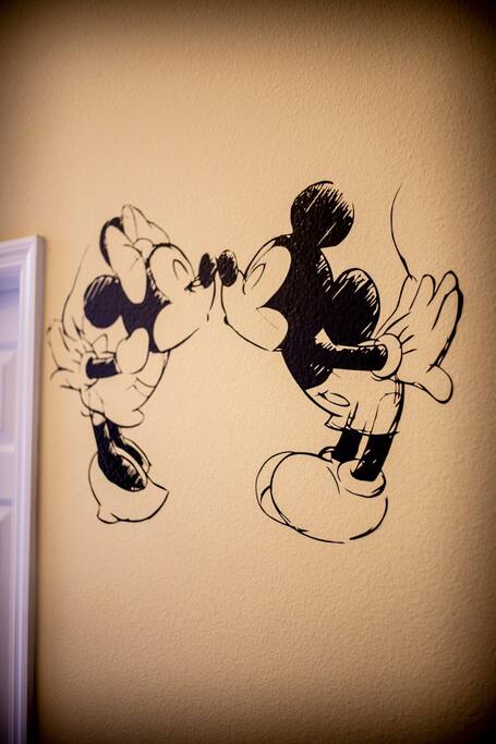 Mickey and Minnie Mouse welcoming you home