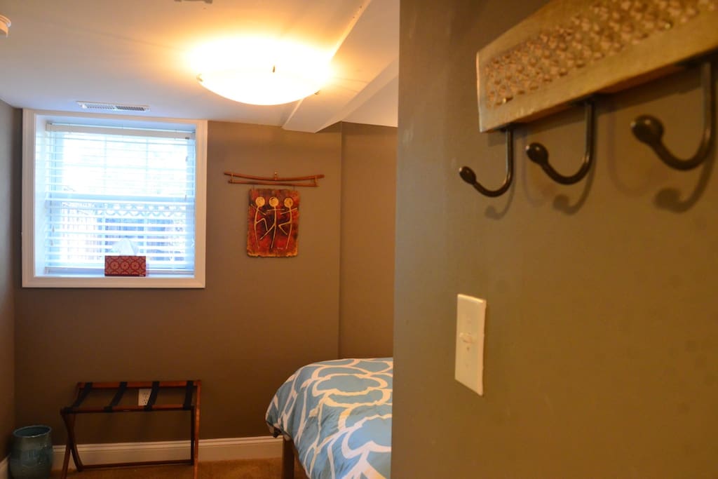 Practical space with lots of hooks, storage space, and a luggage rack