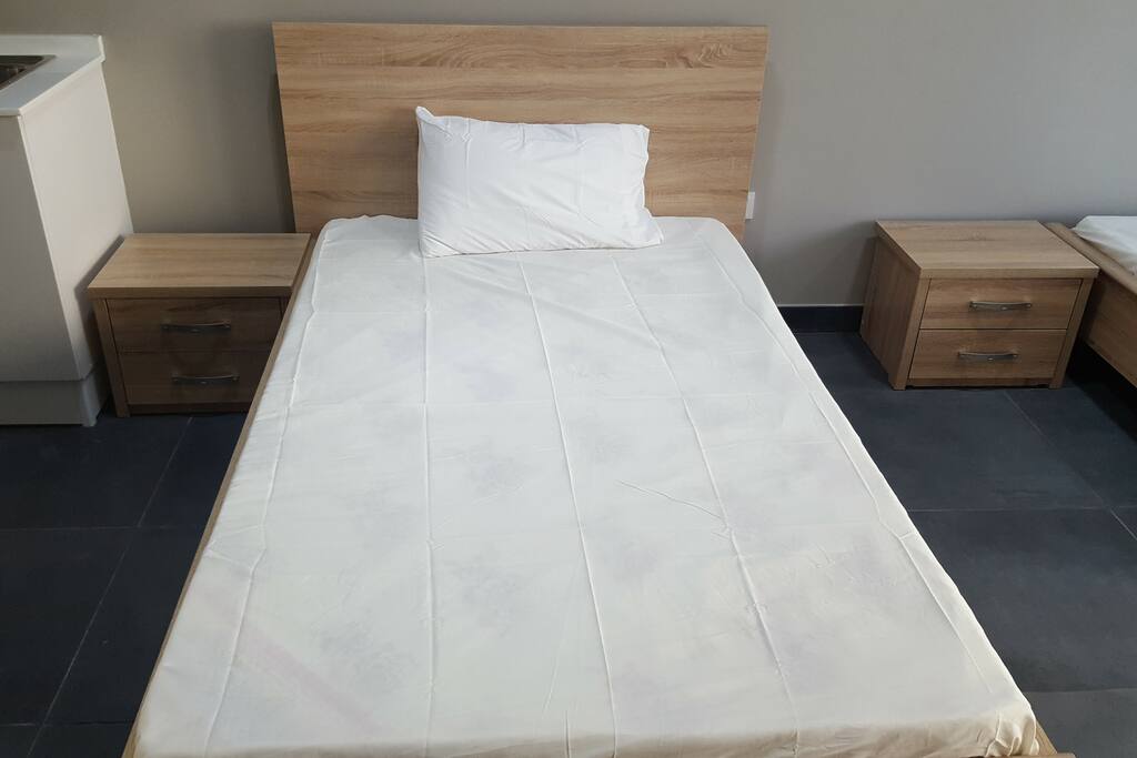 Single bed in living room
