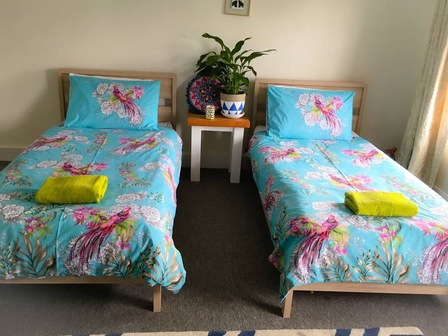 Twin beds in main bedroom can be pushed together to form a double bed, with a thick mattress topper and double bedding.
