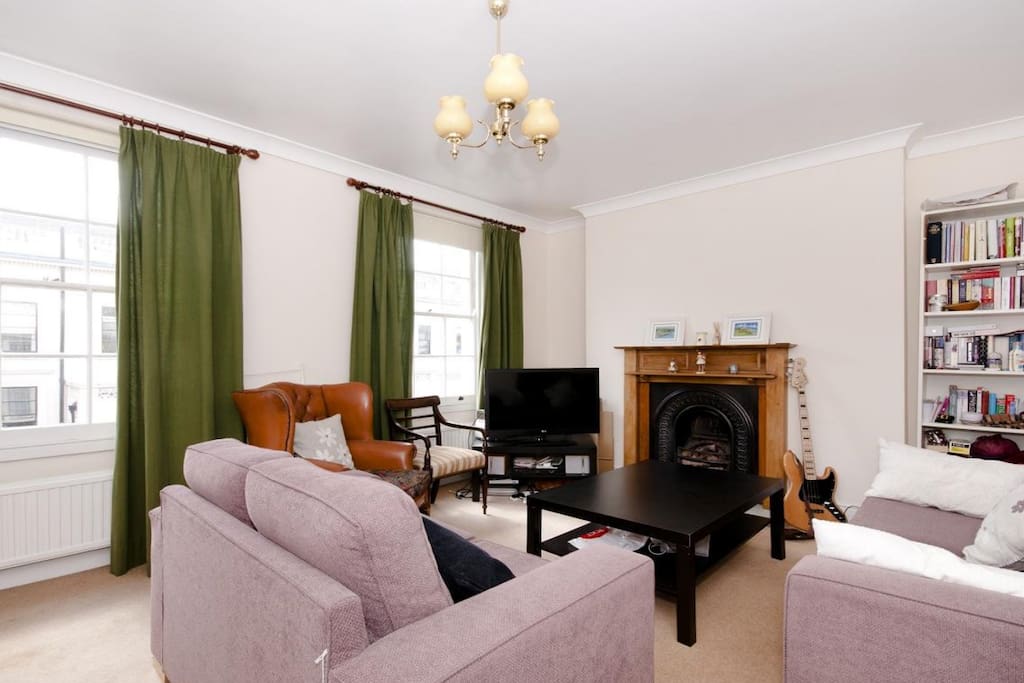 Large, airy living room getting lots of sunlight