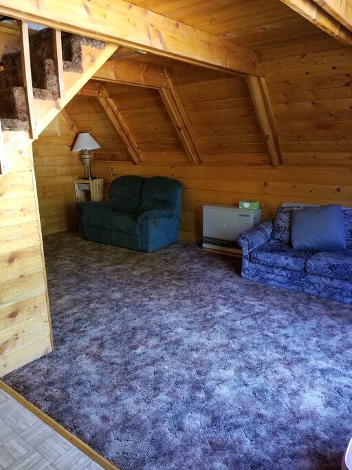 Family room w/queen size hide-a-bed couch & love seat