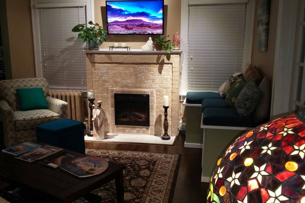 Welcome to my home. The living room space offers a warm color palette.
