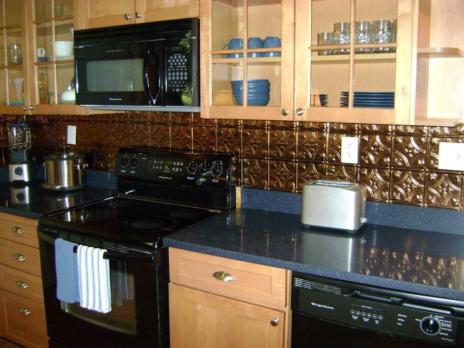 Create memorable culinary delights in the opulently appointed gourmet kitchen.