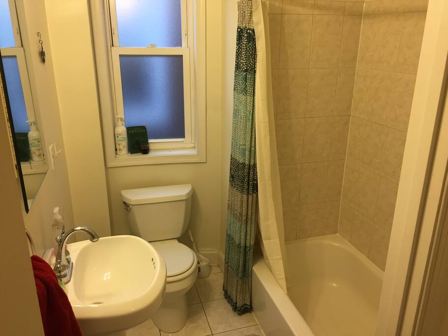 Private bathroom with tub and shower