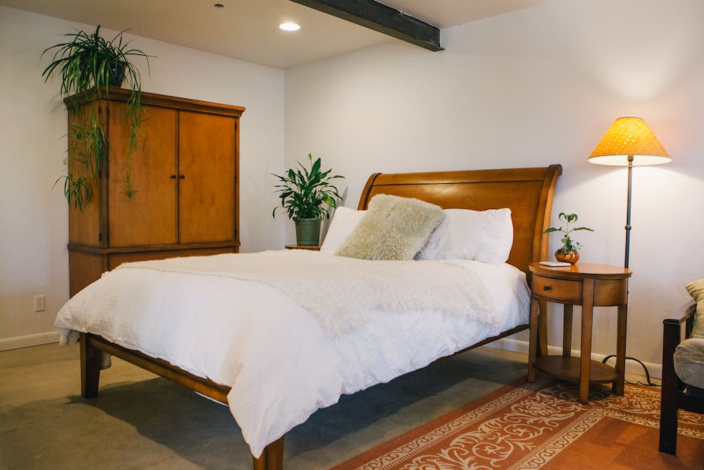 Stunning armoire and sleigh bed bedroom set, feather down comforter and Egyptian cotton sheets