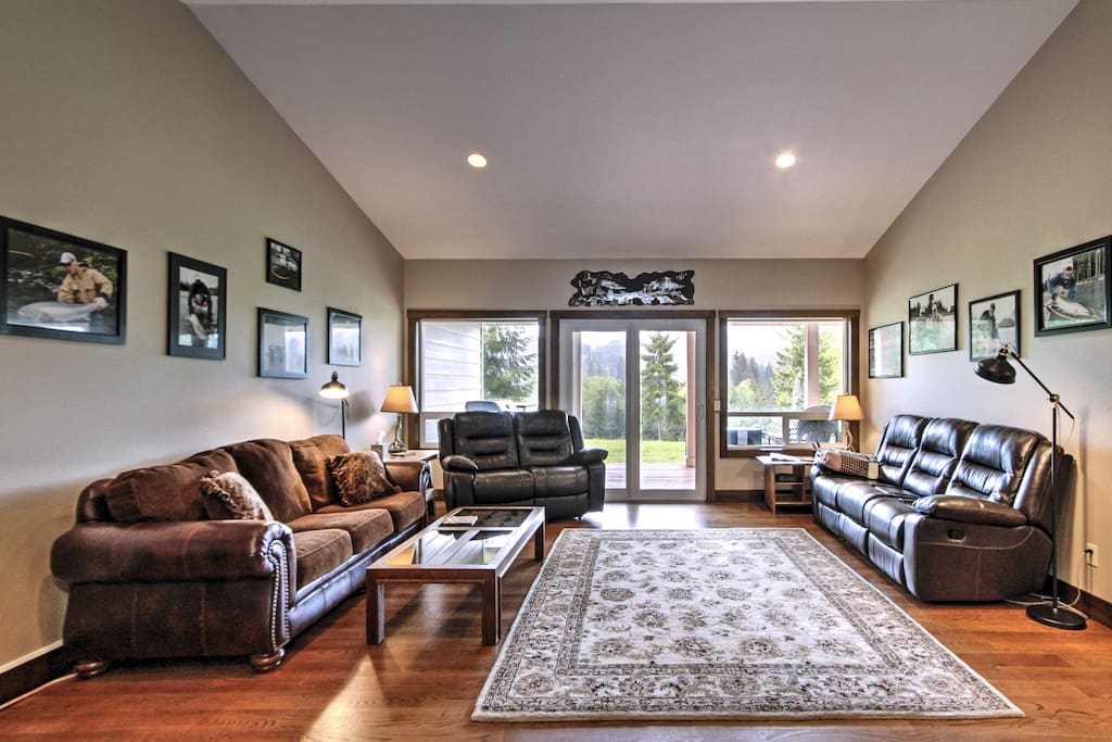 The living space features pristine hardwoods floors, an electric fireplace and natural light flooding from sliding patio doors.