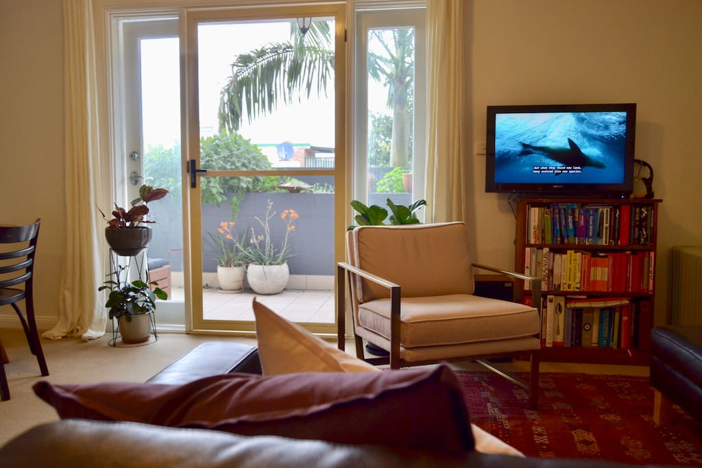 Cozy living area, opens up to a spacious balcony