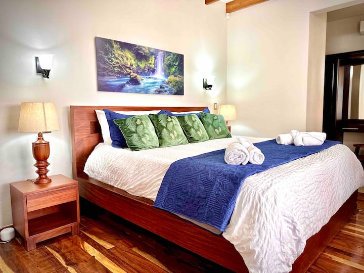 Master bedroom with a king bed