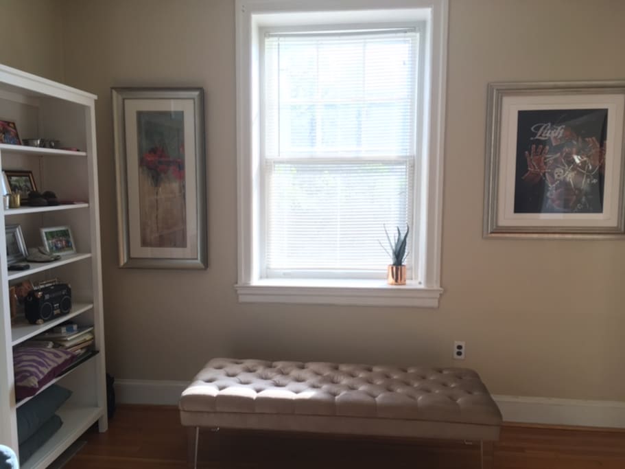 Living room bench adds tasteful touch and additional seating.