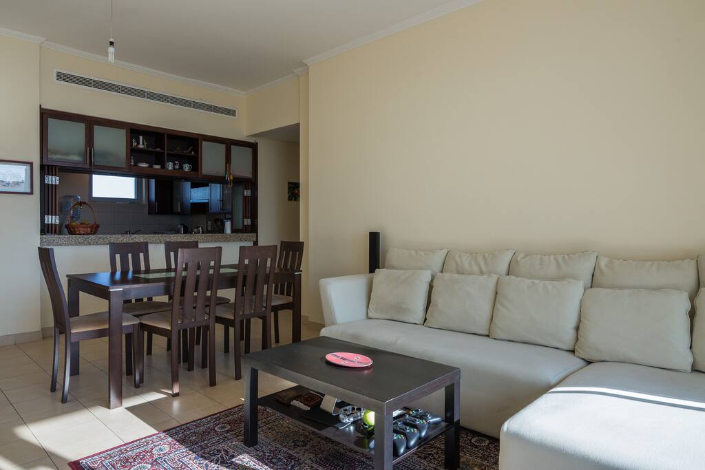Dinning table with window access to the kitchen.