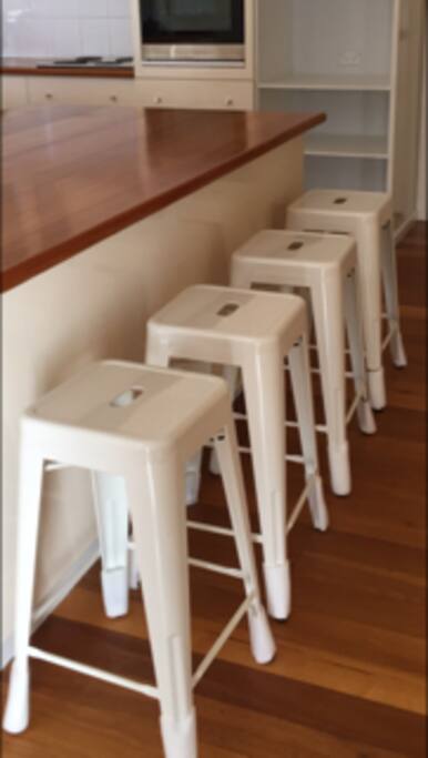 New bar stool seating at the large kitchen island bench.
