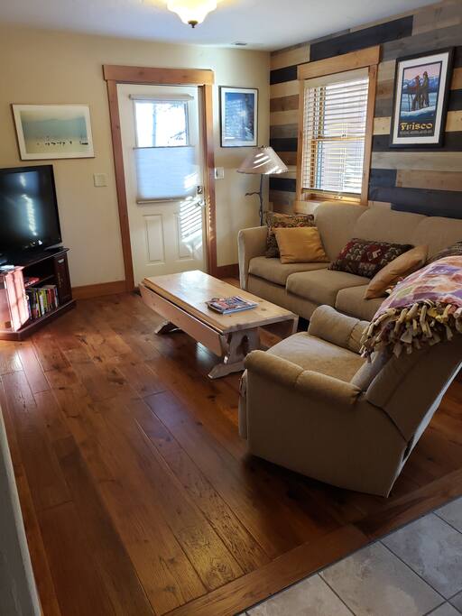 Living room and door to outside hot tub