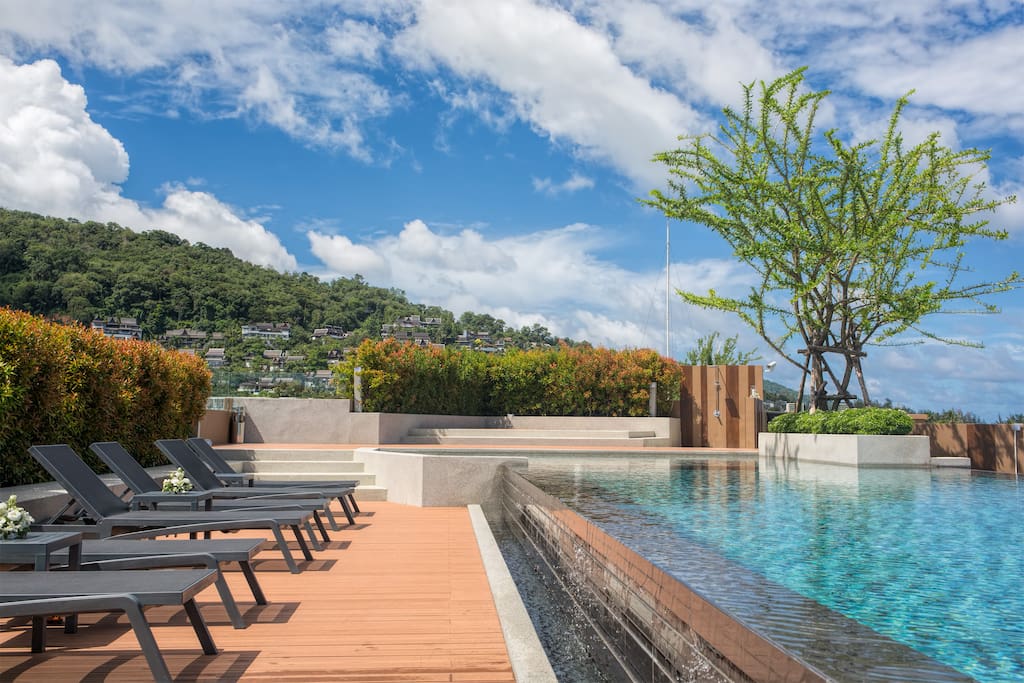 Infinity swimming pool on the roof top with the stunning mountain & sea views