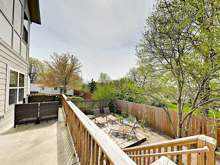 Lounge outdoors with a sitting area on the deck and on the patio.