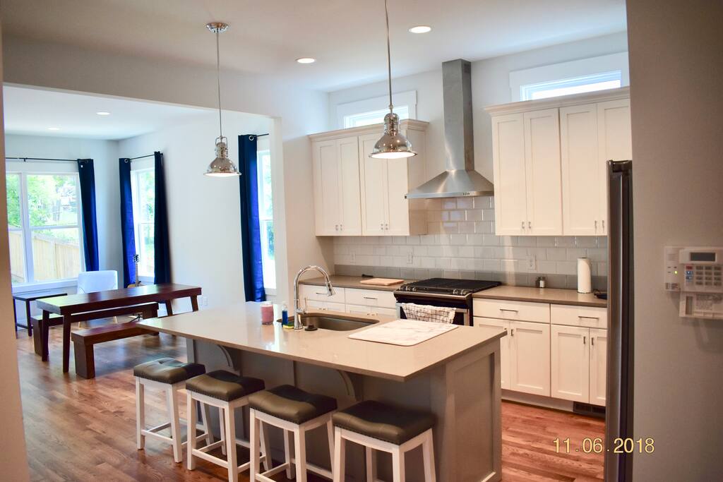 Open floor plan kitchen leading to dining/living room