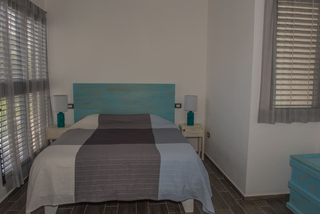 Room with king size bed and private bathroom