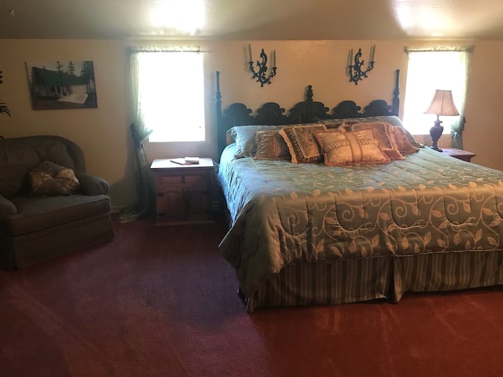 Master Retreat to relax and enjoy the seasons. Sky light, sitting chair, king size bed, master closet that is like a small room, personal TV with an Amazon Firestick. 
