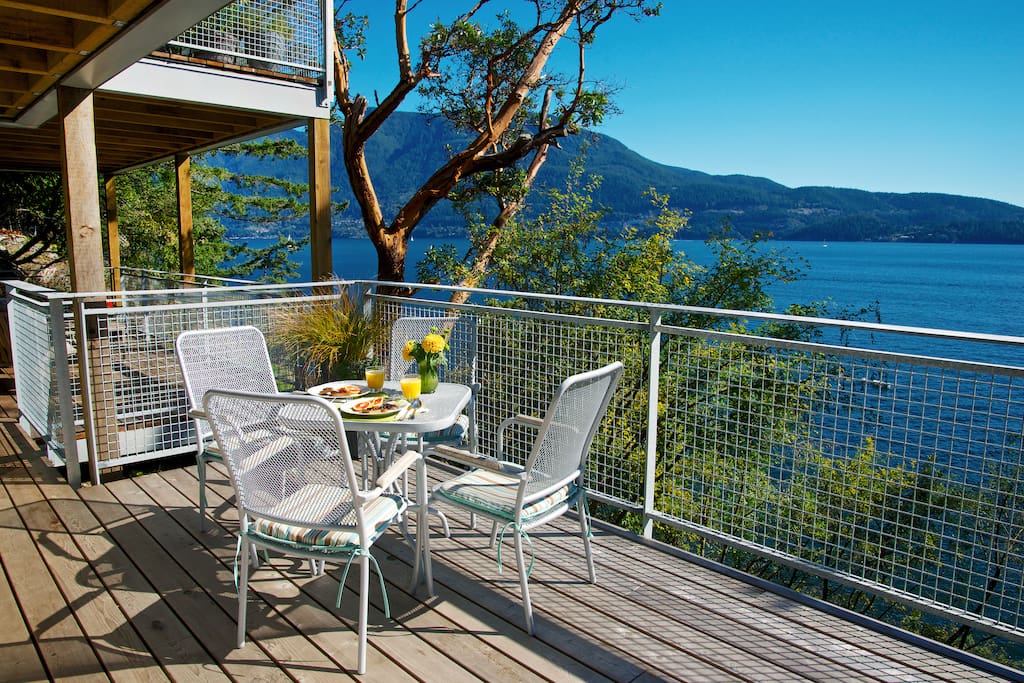 The Lazy B Waterfront Suite has expansive sun drenched seaside decks with patio dining for 4 and a briquette BBQ. 1 minute to beach