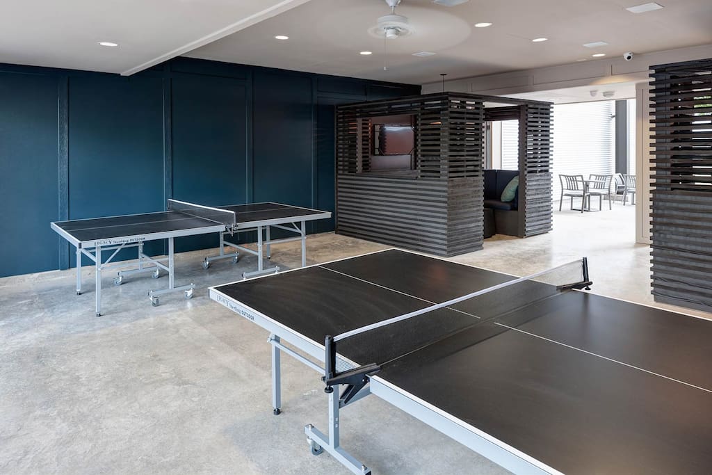 Ping Pong tables are near the apartment to play a nice game.