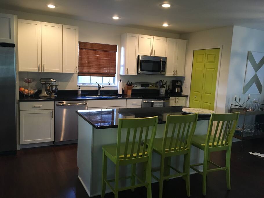 Modern Kitchen with island bar and stainless-steel appliances