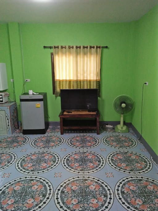 Living area, TV and refrigerator