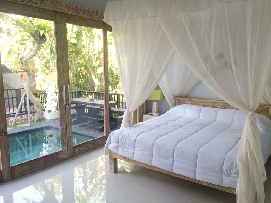 bedroom overloking pool