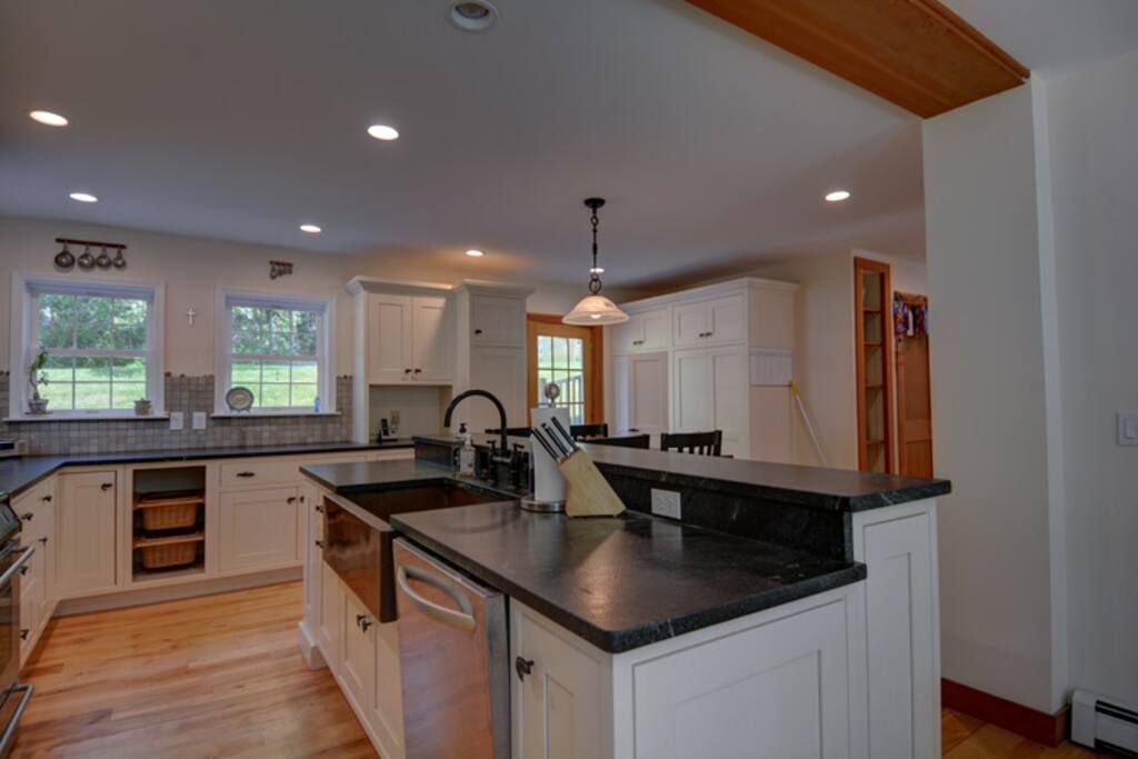 Granite countertops, stainless steel appliances and wood floors.