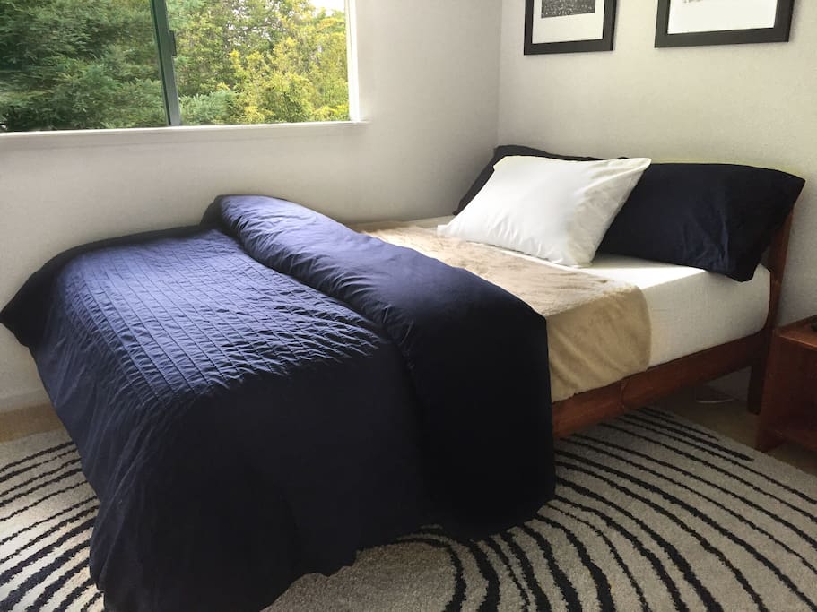 Bedroom gets lots of natural light during the day and has 2 lamps for the evening.