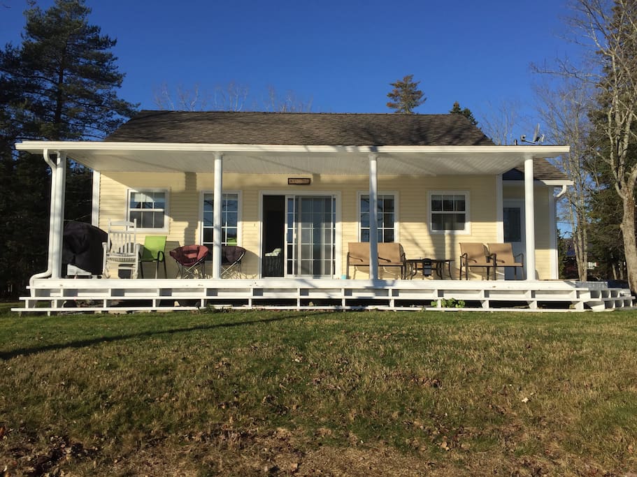 This stunning little house has a huge deck overlooking the lake.