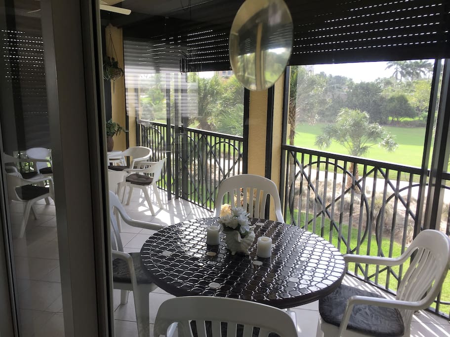 View through the Living Room Lanai sliding door to the 3rd hole of Hammock Bay Golf Club