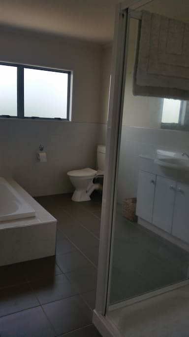 Guest Private bathroom with shower and bath.