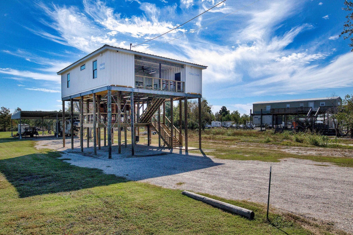 Daytime exterior of elevated Camp Conex in Shell Beach