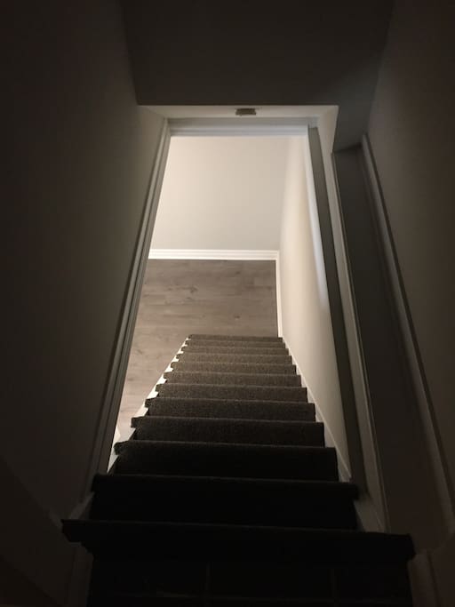 Stairs immediately inside door