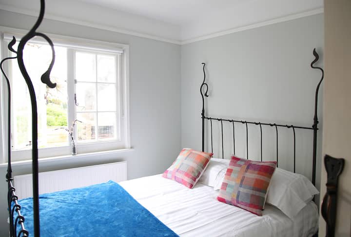 Art Nouveau bedroom with stunning garden and beach views alongside the monsoon shower room on the ground floor