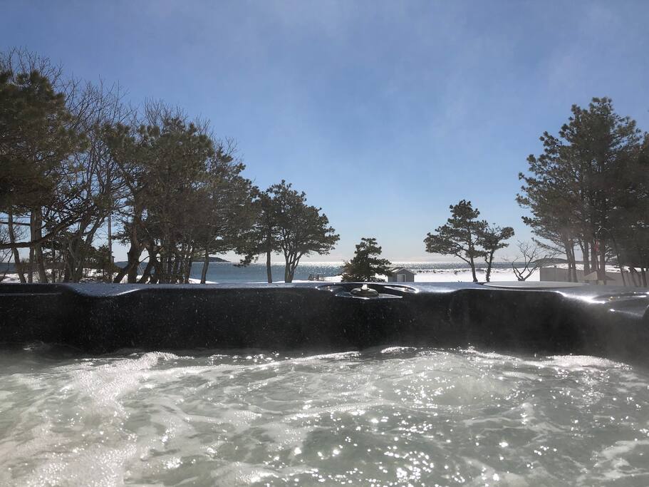 Relax in the hot tub with view of the water