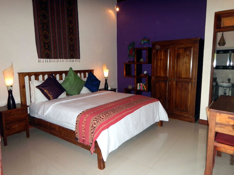 King sized teak bed with high quality mattress.