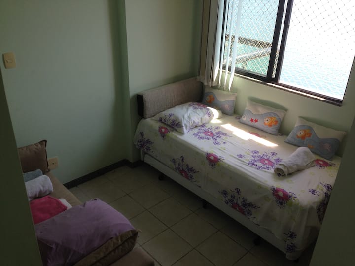 Another bedroom with a double bed and 2 separate mattresses