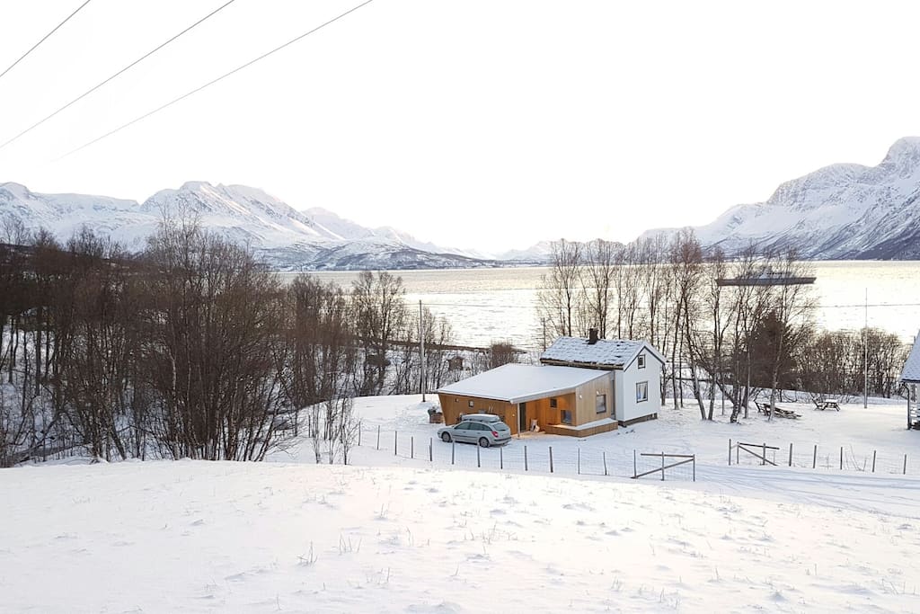 The cabin and view southwards across Ulsfjorden