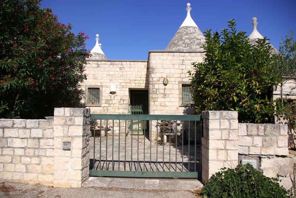 The backyard entrance to the Trullo with private parking (1 car)