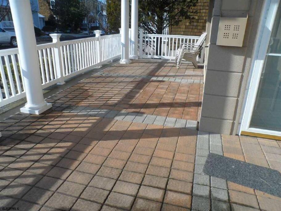 Sunny front deck with patio furniture (not shown)
