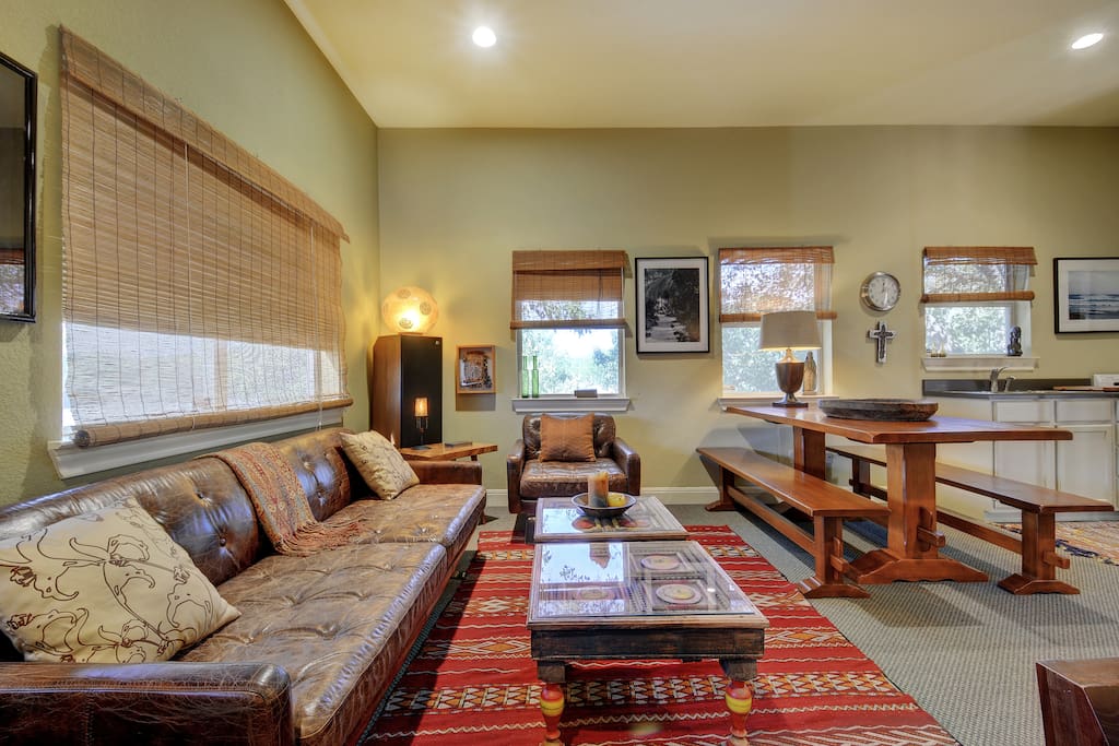 Another living area, a kitchenette, and queen-sized bed in the studio space.