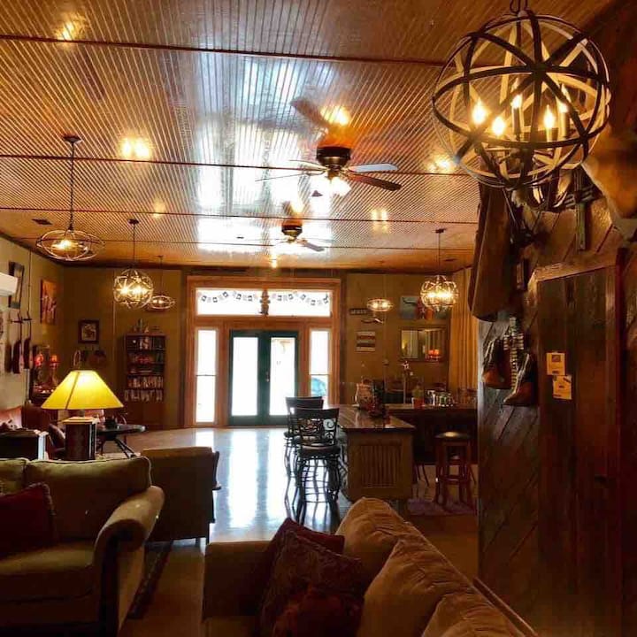 The Bunkhouse has a spacious open floor plan. There are 9 chandeliers to provide warm lighting.  