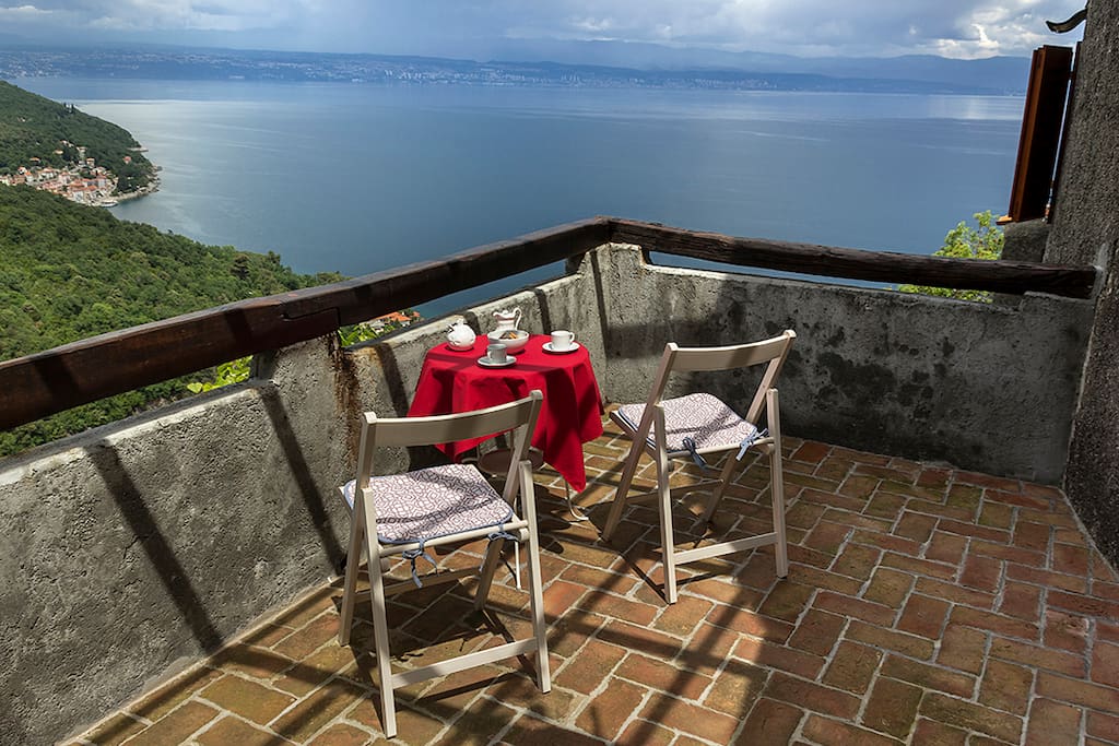 Private upstairs balcony with a stunning view is perfect for breakfasts or afternoon coffee.